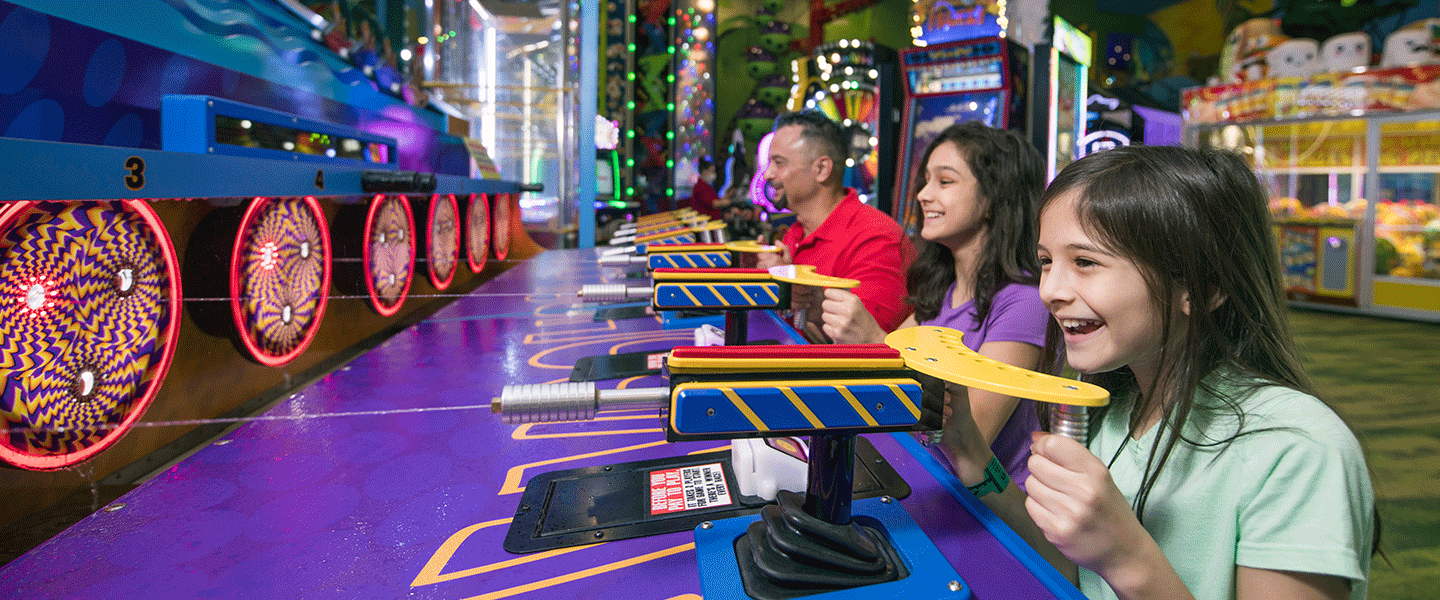 Family playing in the arcade