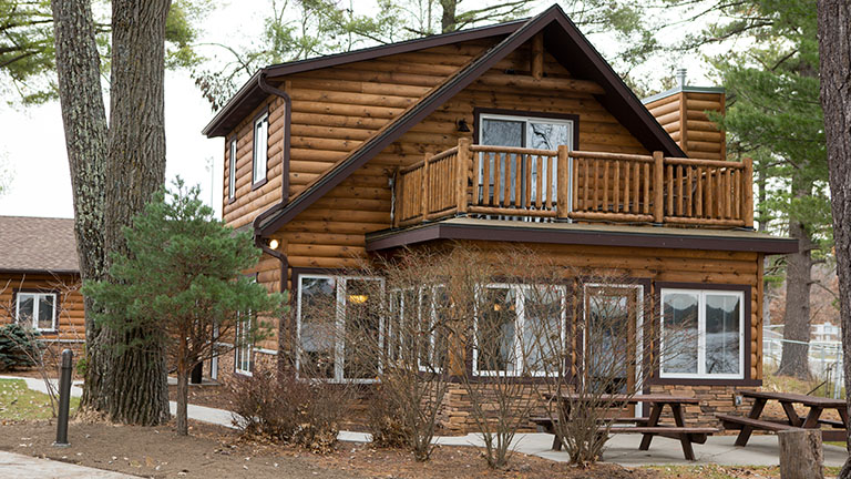 Lake Delton Waterfront Cabin with two picnic tables outside