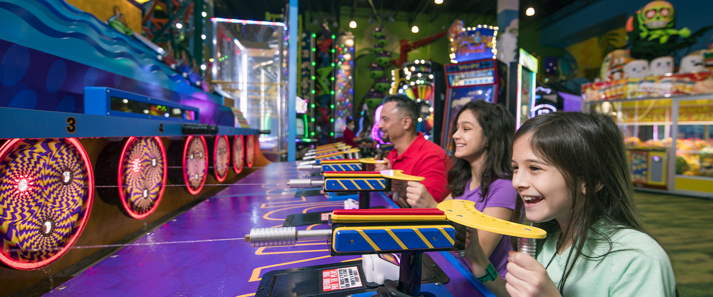 Family playing in the arcade